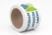 Custom tape roll with “Happy Resident Appreciation” printed in bold blue text alongside green and blue triangular shapes.